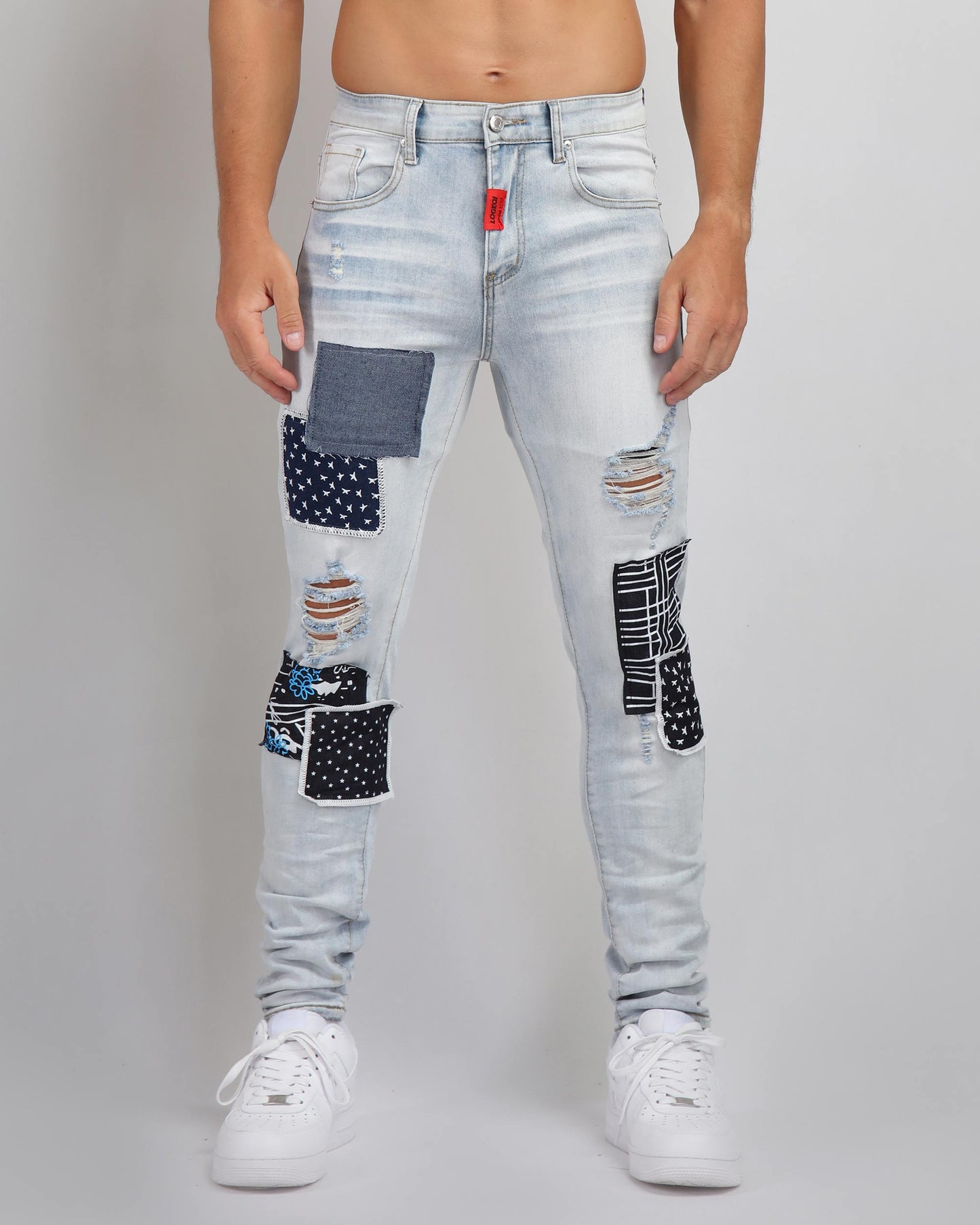 Blue Ripped Jeans with Striking Black Patches